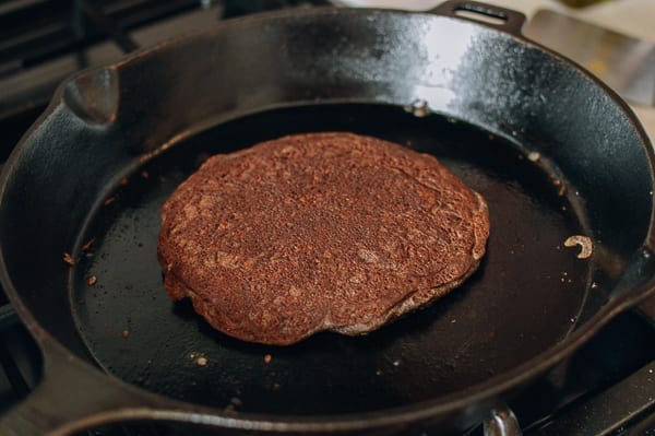 Cooking buckwheat pancakes in cast iron skillet, thewoksoflife.com