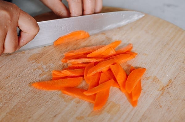 Thinly slicing a small carrot, thewoksoflife.com