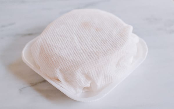 Keeping dumpling wrappers under damp towel, thewoksoflife.com