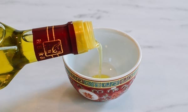 Pouring Sichuan Peppercorn Oil, thewoksoflife.com