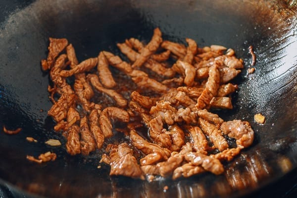 Stir-fried strips of pork with dark soy sauce added, thewoksoflife.com