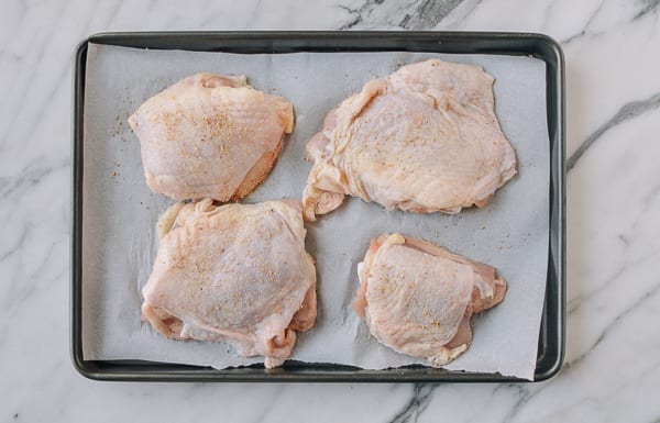 Sheet pan with seasoned chicken thighs, thewoksoflife.com