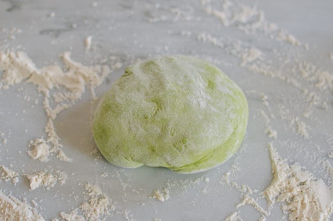 Spinach noodle dough on floured surface, thewoksoflife.com