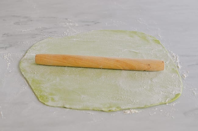 Rolling noodle dough with rolling pin, thewoksoflife.com