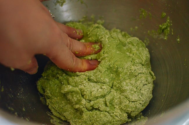 Pushing spinach noodle dough together with hands, thewoksoflife.com