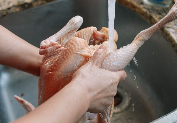 Rinsing chicken cavity, thewoksoflife.com