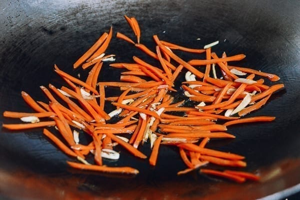 Julienned carrots in wok, thewoksoflife.com
