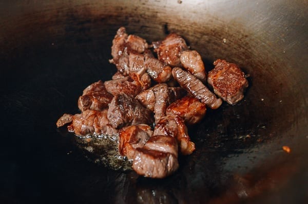 Seared steak cubes in wok, thewoksoflife.com