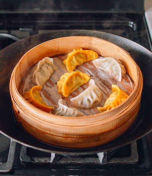 Steamed dumplings in bamboo steamer, thewoksoflife.com
