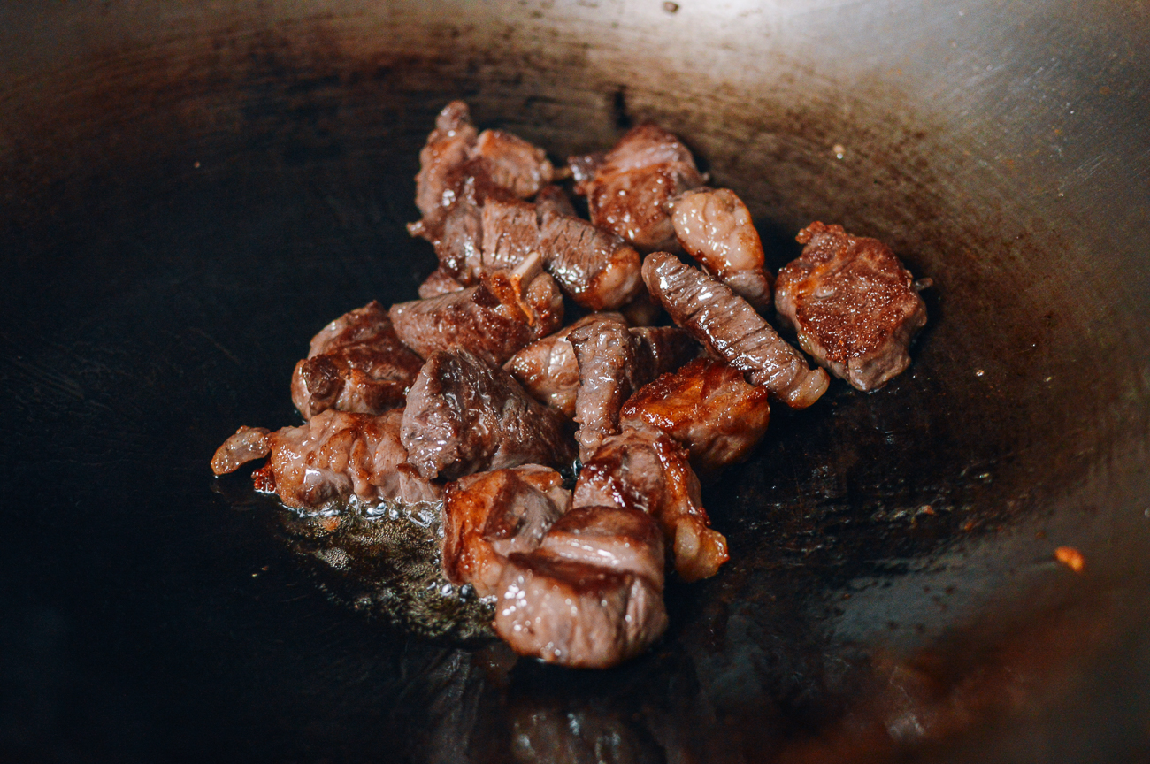 stir-frying steak chunks