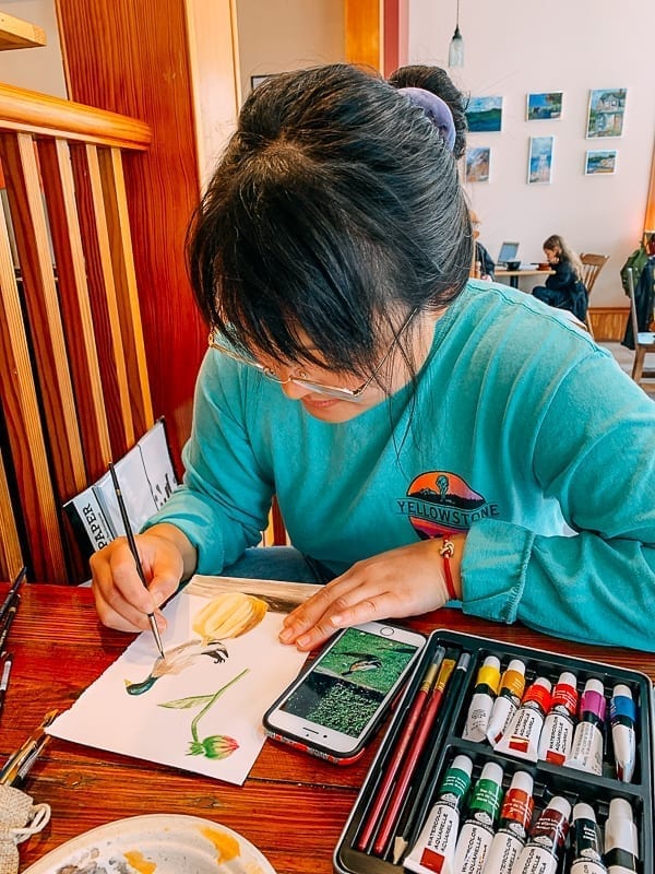 Kaitlin painting watercolors on a rainy day, thewoksoflife.com