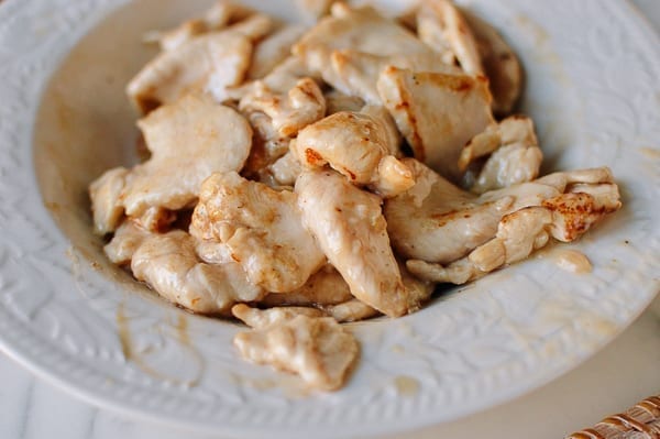 Partially cooked chicken slices, thewoksoflife.com