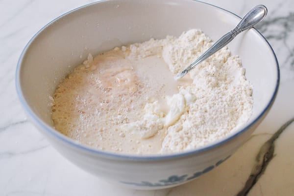 English muffin dough ingredients in mixing bowl, thewoksoflife.com