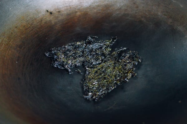 Toasting dried seaweed in wok, thewoksoflife.com