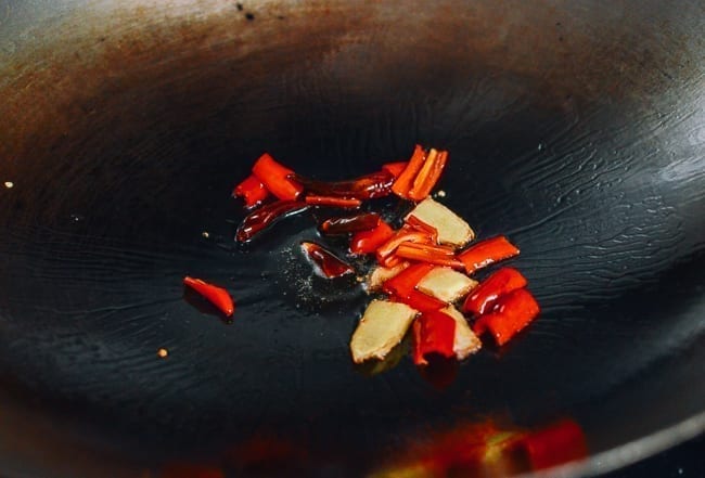Adding red peppers to wok, thewoksoflife.com