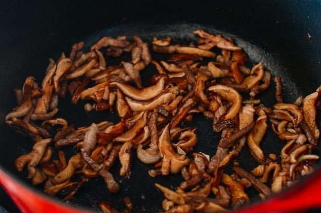Caramelizing mushrooms with pork and mirin, thewoksoflife.com