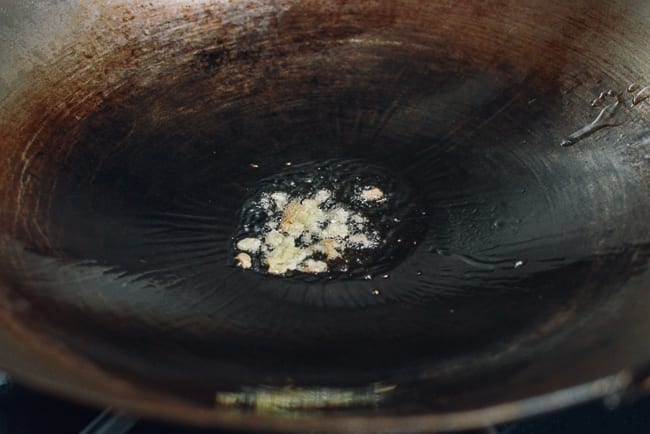 Smashed ginger in wok, thewoksoflife.com