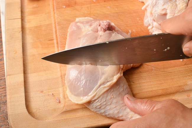 separating drumstick from chicken thigh