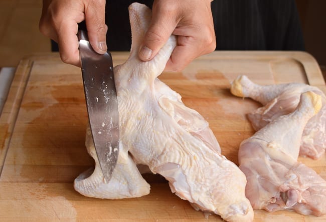 removing chicken wings from rest of chicken