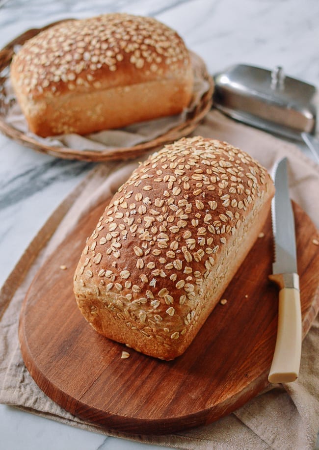 Homemade Multigrain Bread Loaf on cutting board, thewoksoflife.com