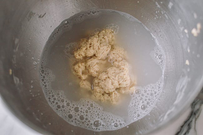 Removing starch until water is mostly clear, thewoksoflife.com