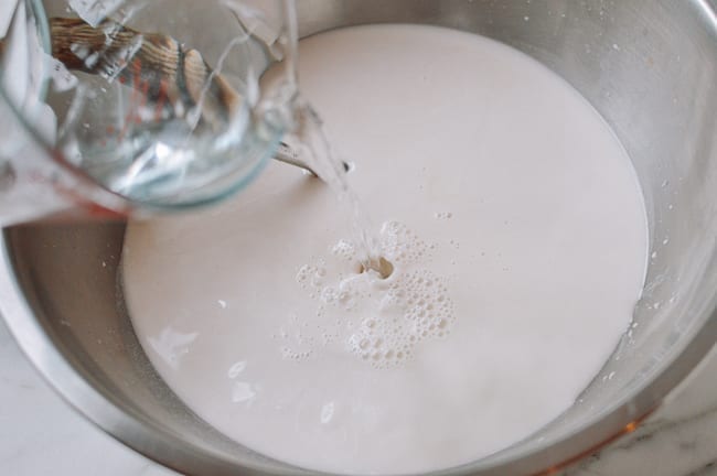 Mixing water into wheat starch to make liangpi batter, thewoksoflife.com
