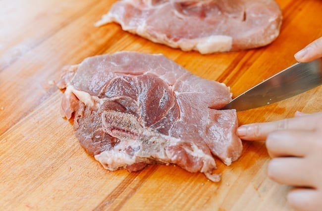 Making cuts in pork loin end chops, thewoksoflife.com