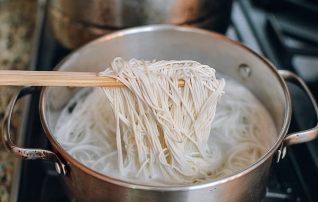 Cooking thin Chinese wheat noodles in pot of boiling water, thewoksoflife.com