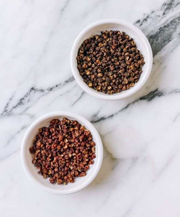 Red and Green Sichuan Peppercorns in small dishes, thewoksoflife.com