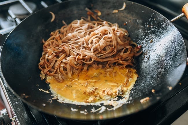 Scrambling eggs into pad thai noodles, thewoksoflife.com