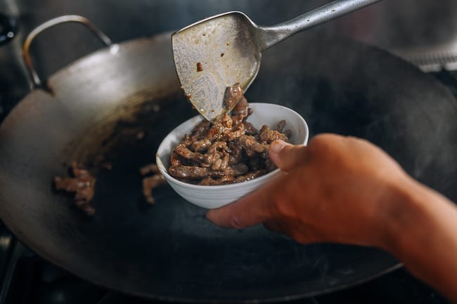 Removing cooked beef from wok, thewoksoflife.com