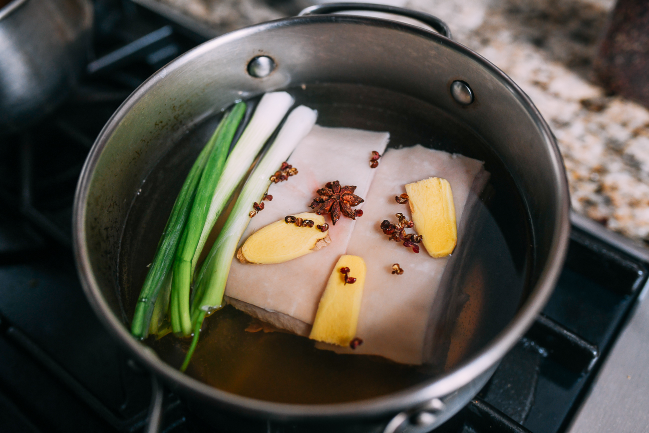 Pork Belly in pot with ginger, scallions, and spices