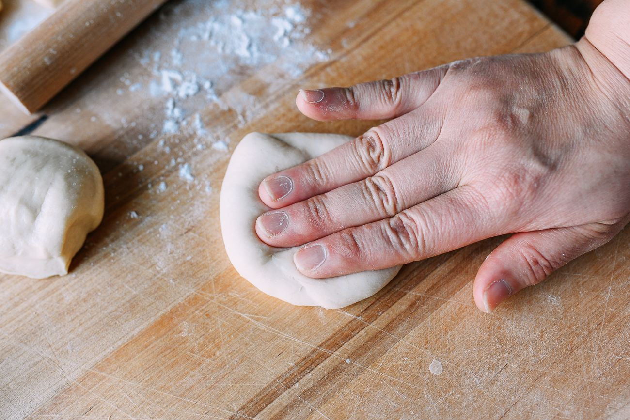 Kneading dough ball to smooth it out