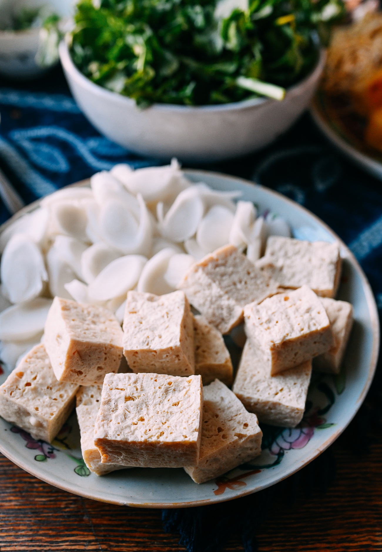 Frozen Tofu on a plate with rice cakes