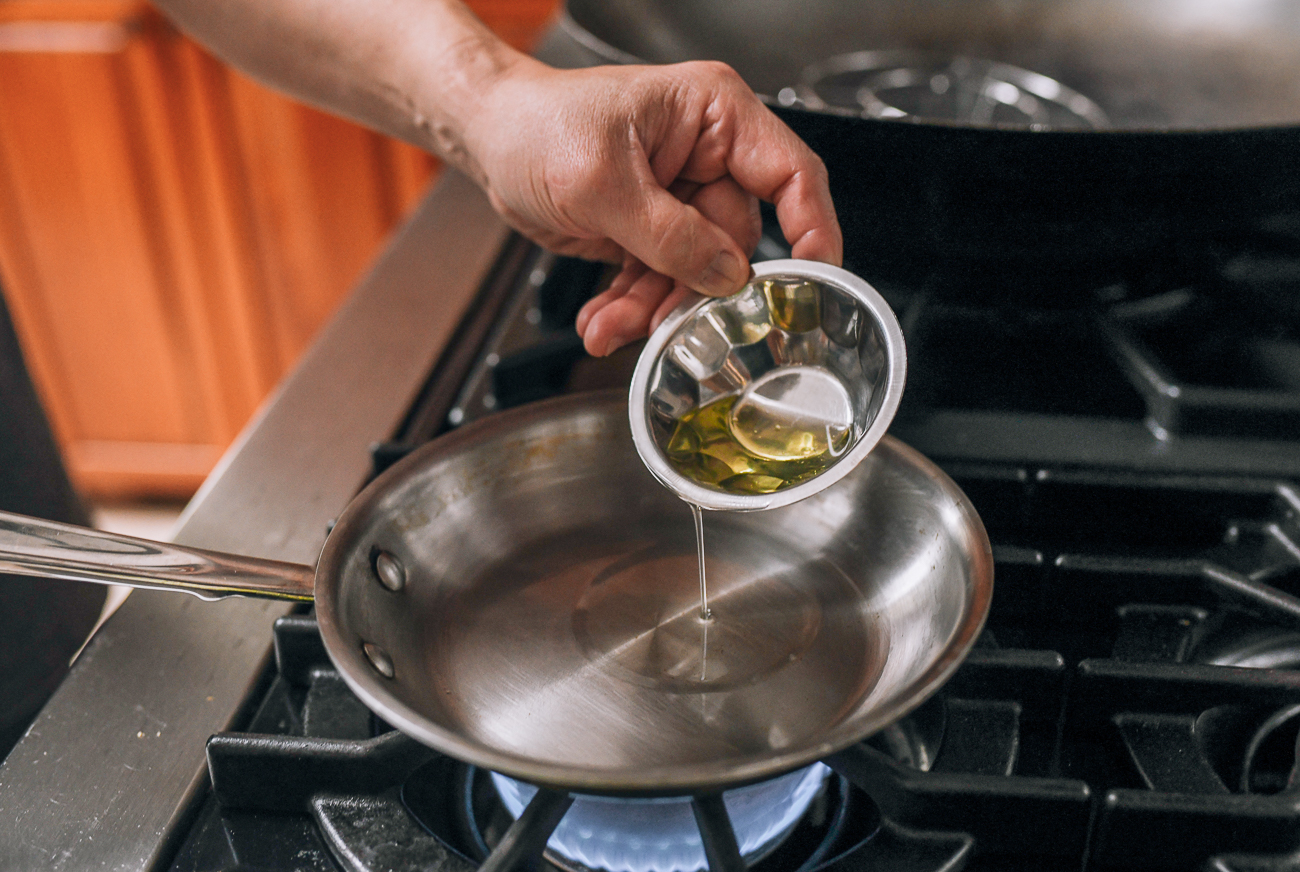 Adding oil to small saucepan