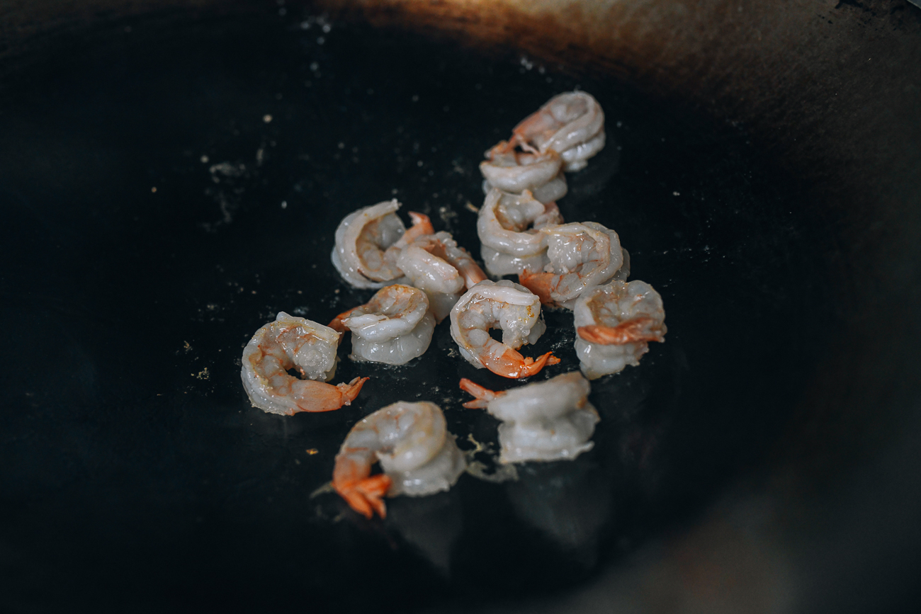 Cooking shrimp in wok