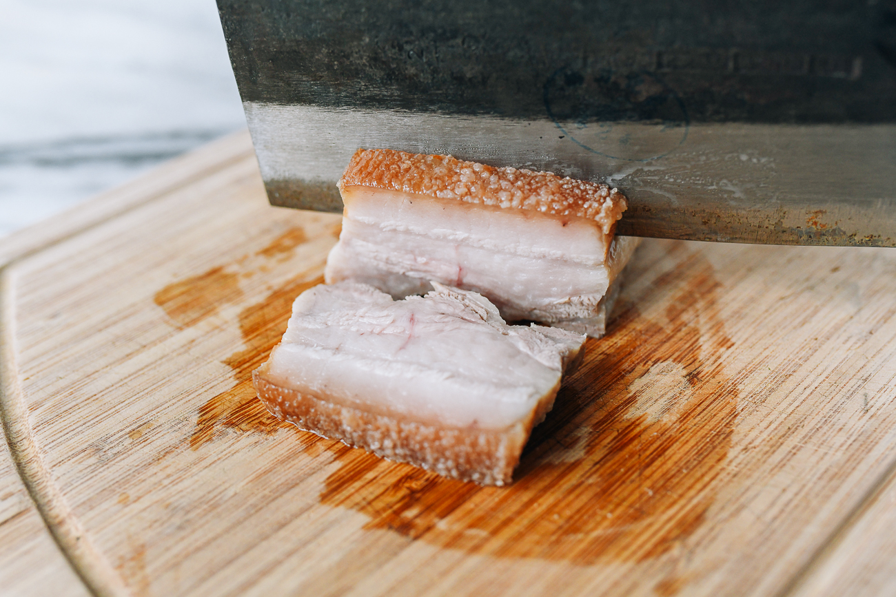 Slicing pork belly into 1/2 inch thick slices