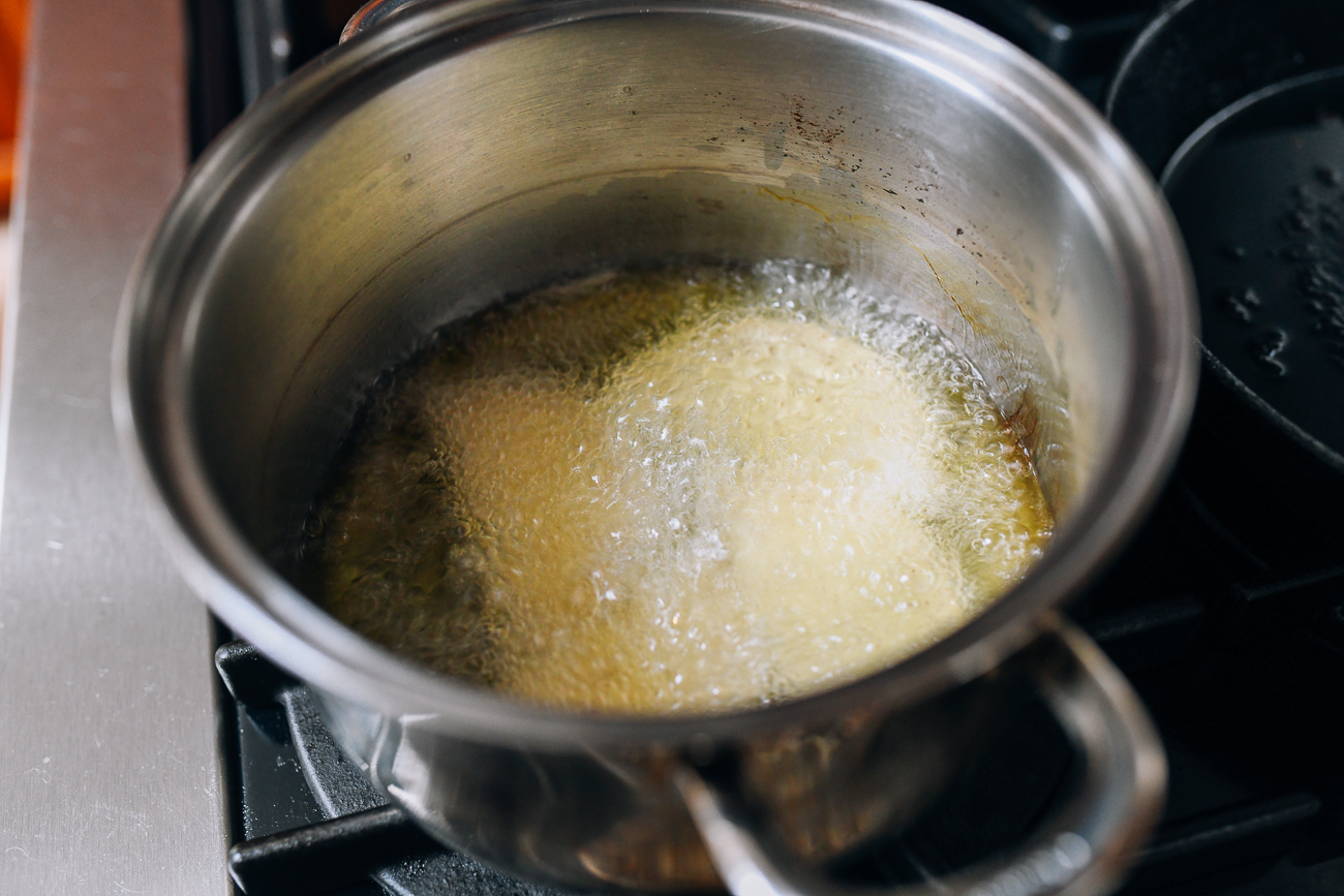 Frying taro slices in oil