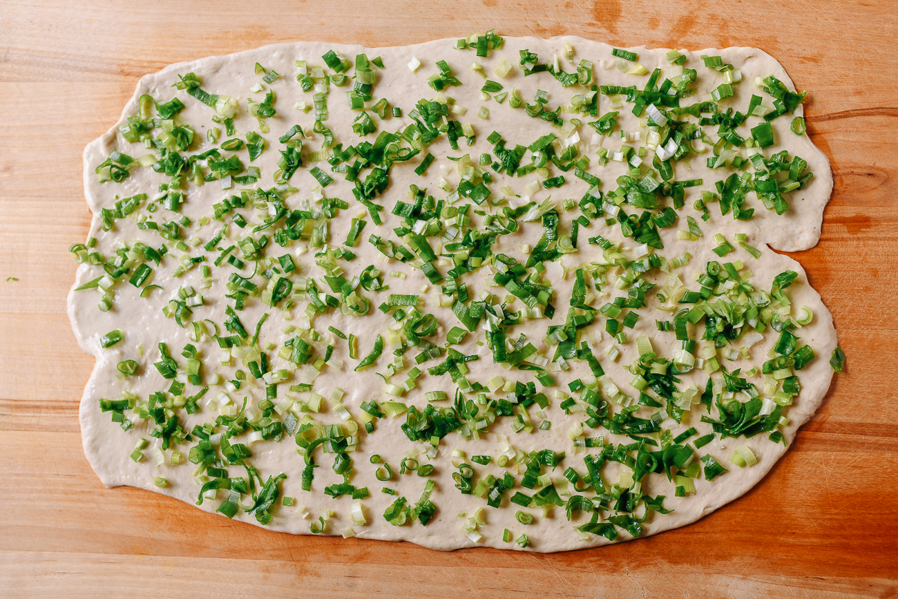 Dough covered with finely chopped scallions