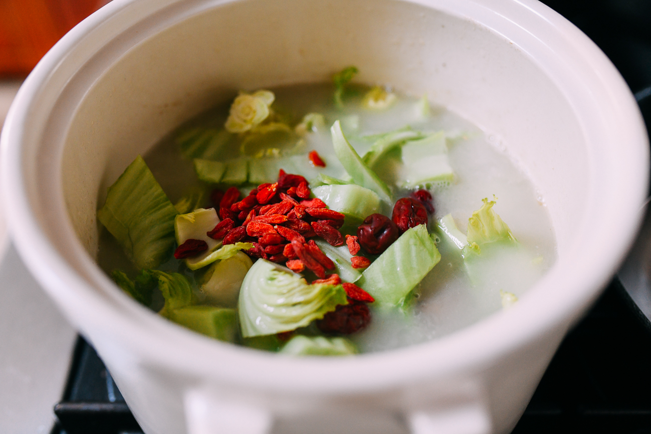 Mustard greens, goji berries, and dates in soup