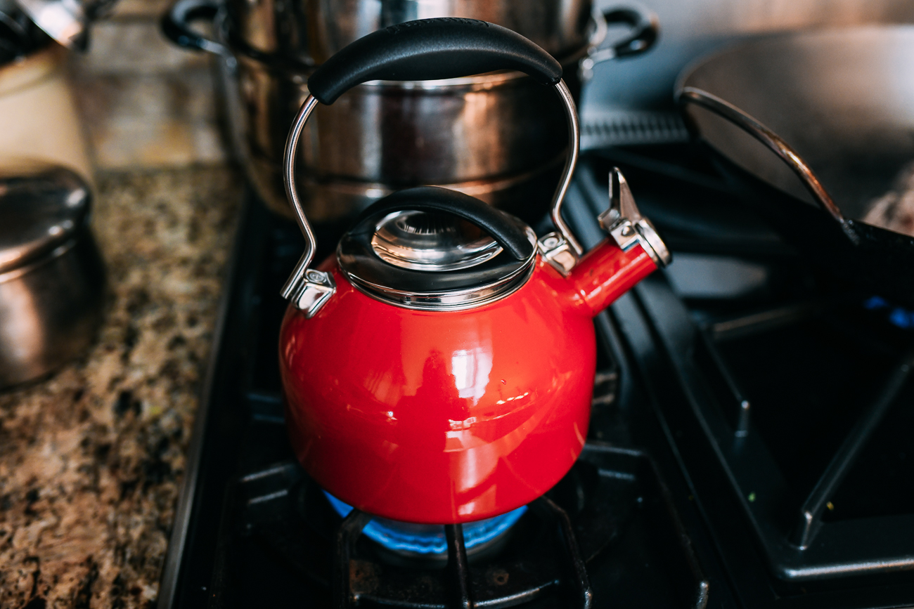 Red tea kettle on stove