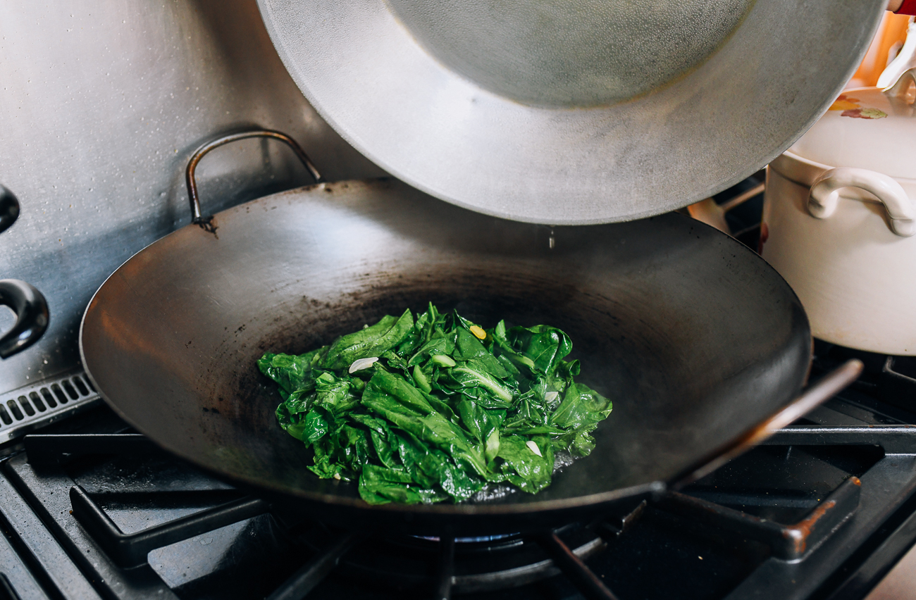 Uncovering Chinese broccoli in wok