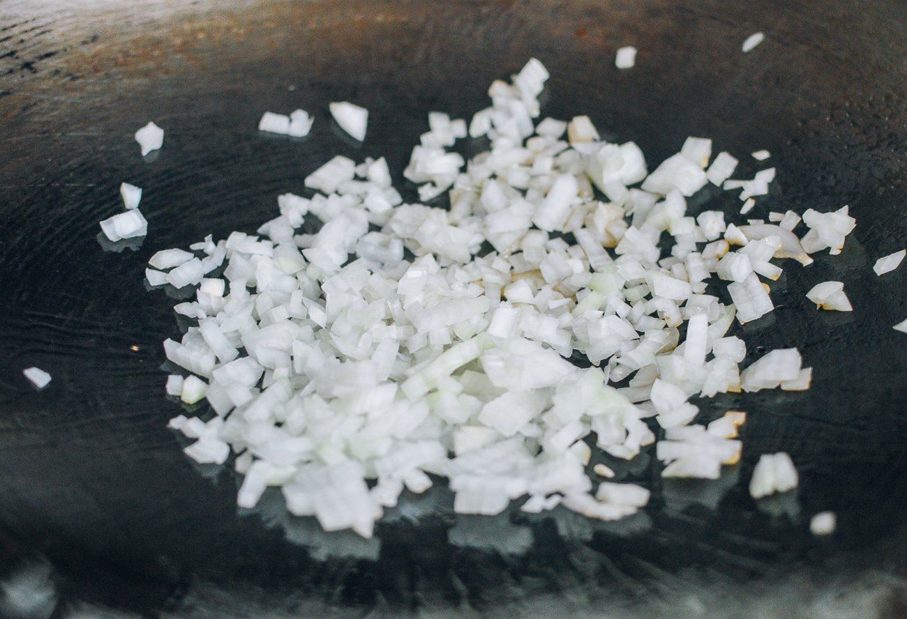 Cooking diced onions in wok
