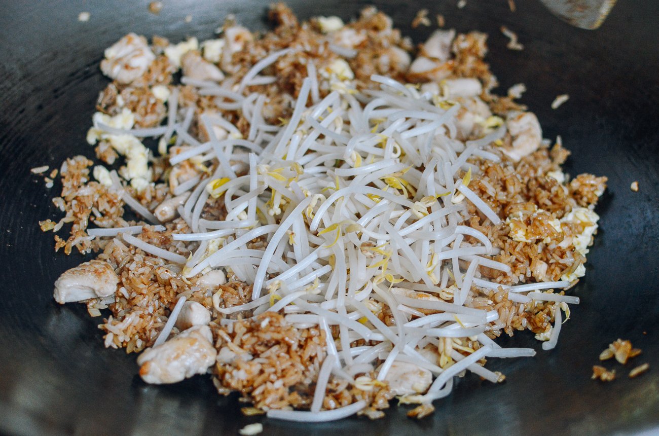 Adding bean sprouts to chicken fried rice