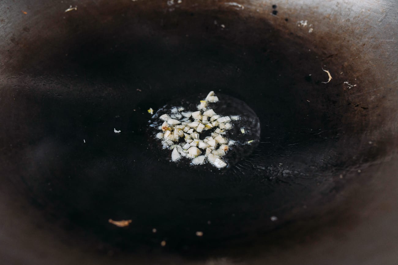 Cooking garlic in wok