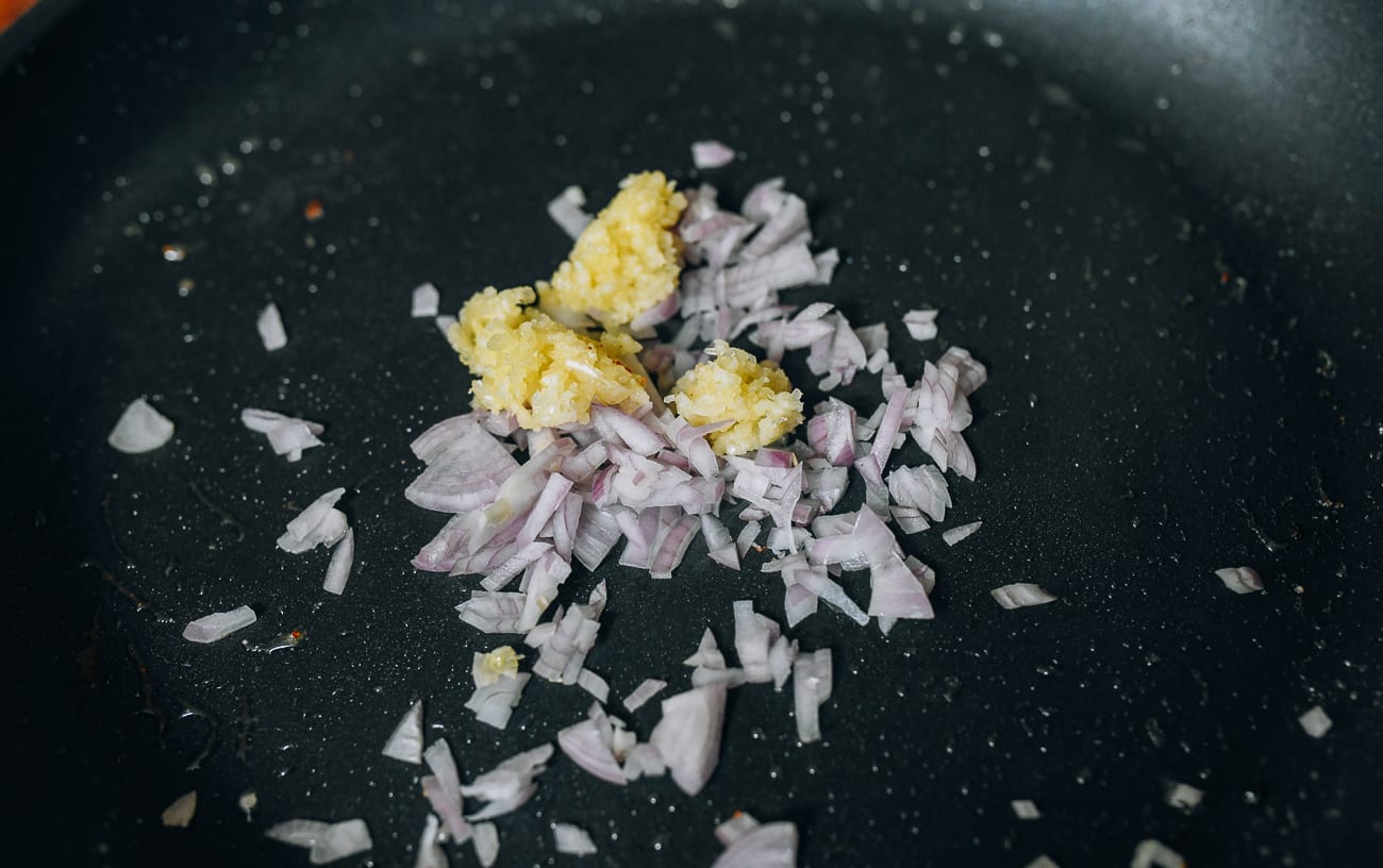 Cooking shallots and garlic in pan