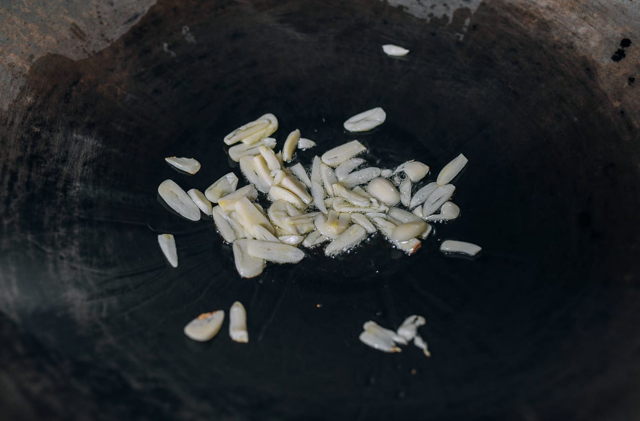 Cooking garlic in wok