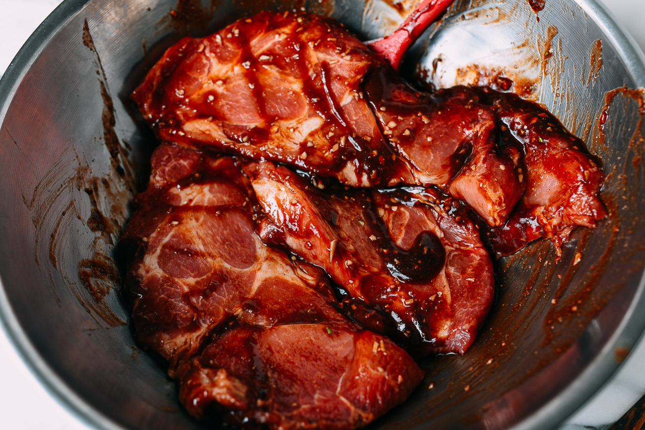 Tossing pork in marinade