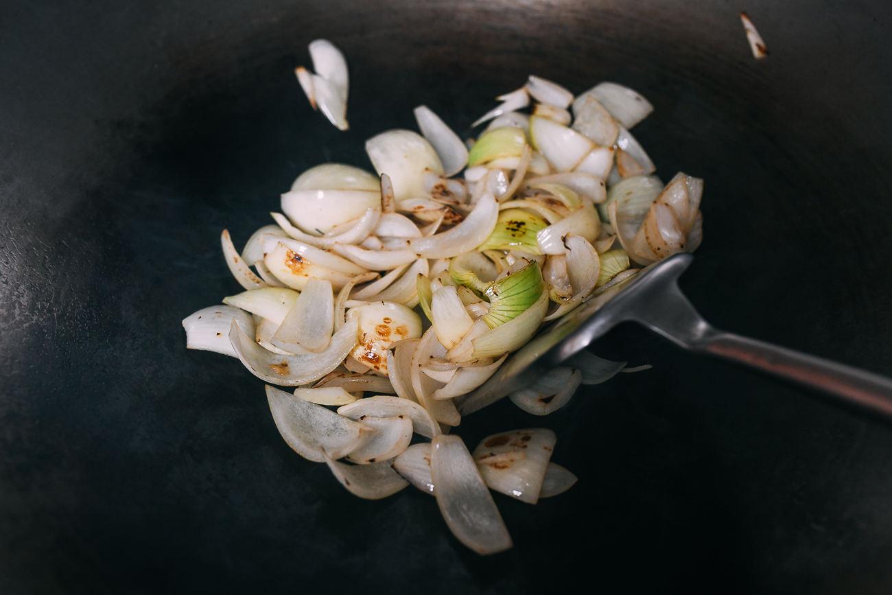 Seared onions in wok