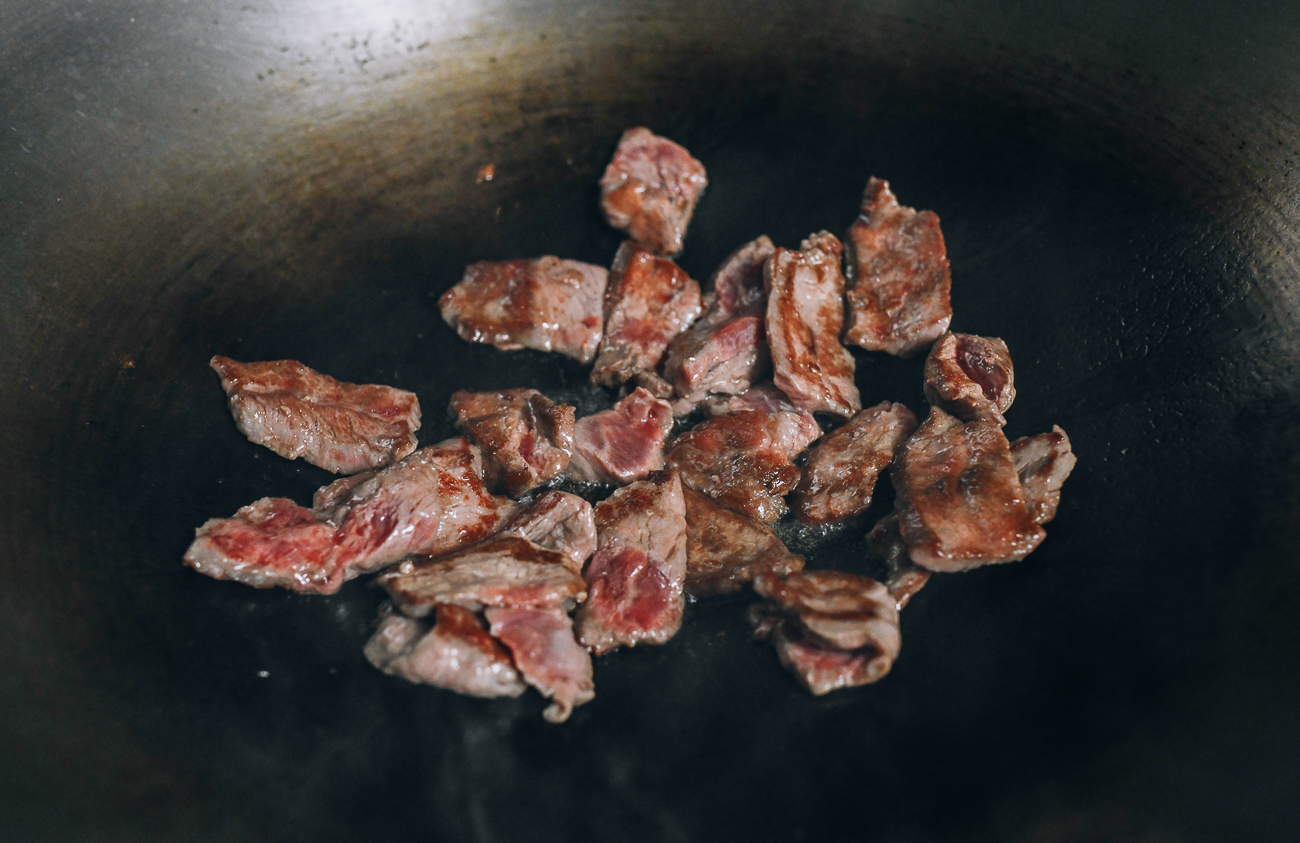 Seared flank steak in wok